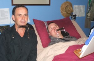 Jeremy with a hands-free harmonica student
