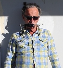 Jeremy playing harmonica hands-free using a neck rack